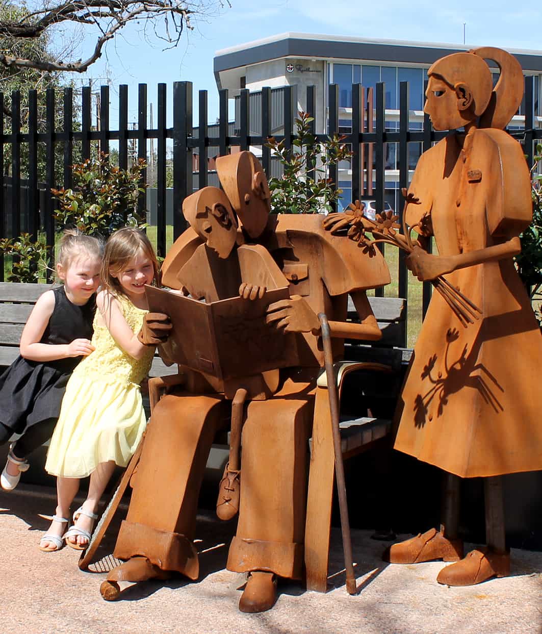 Matilda and Polly reading with the statue