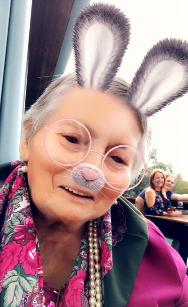 Resthaven community services client playing with Snapchat