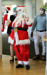 Lady dressing up as Santa