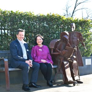 Darren Birbeck and Nora Tuazon sit on the front bench at Resthaven Head Office