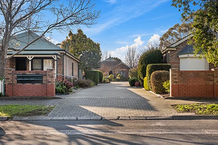 Exterior of houses with paved communal driveway